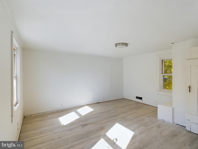 unfurnished room featuring light wood-type flooring