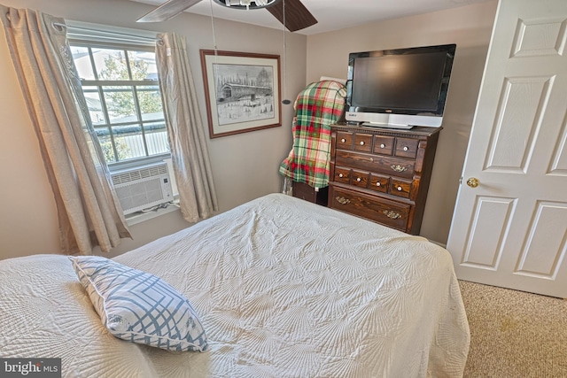 carpeted bedroom with ceiling fan and cooling unit