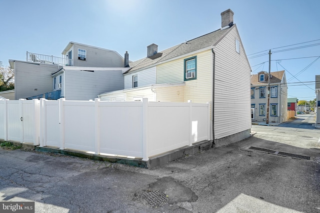 view of side of property featuring a balcony