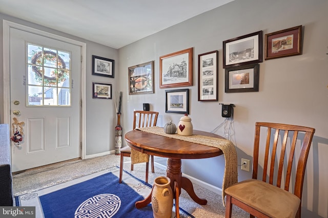 dining space featuring carpet