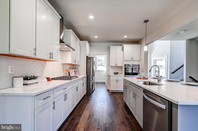 kitchen featuring white cabinetry, appliances with stainless steel finishes, sink, and dark hardwood / wood-style floors