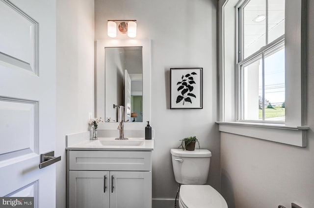 bathroom with toilet and vanity