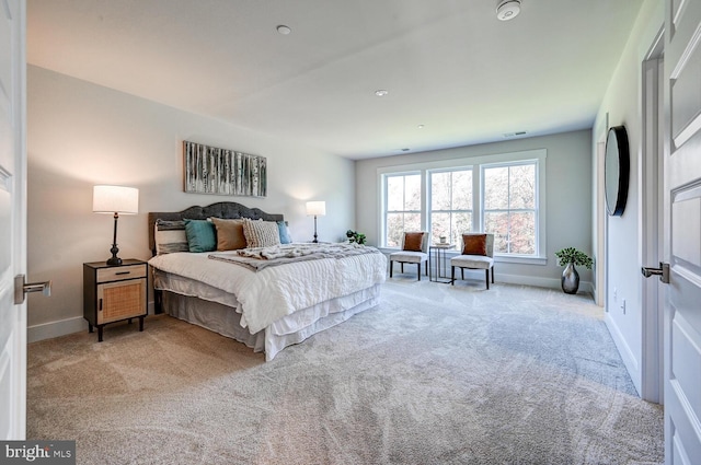 bedroom with light colored carpet