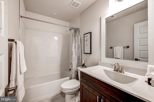 full bathroom with vanity, shower / bath combination with curtain, toilet, and tile patterned floors