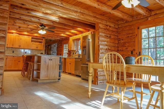 kitchen featuring log walls, light tile patterned floors, stainless steel appliances, and wooden ceiling