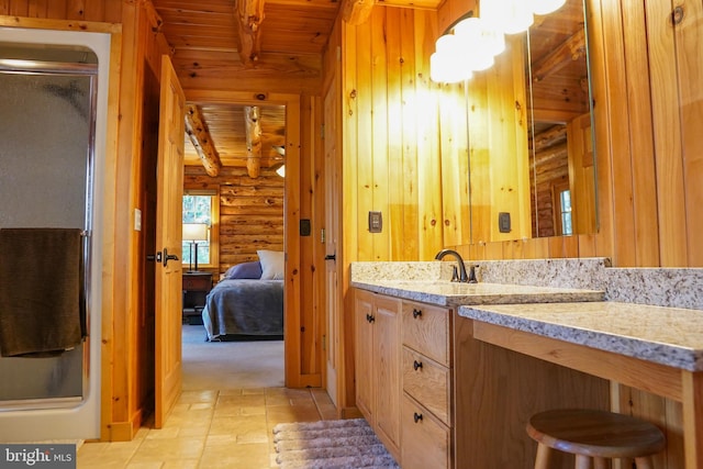 bathroom featuring vanity, wooden ceiling, rustic walls, beam ceiling, and a shower with shower door