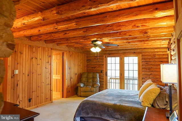 bedroom with light carpet, log walls, beamed ceiling, and wooden ceiling