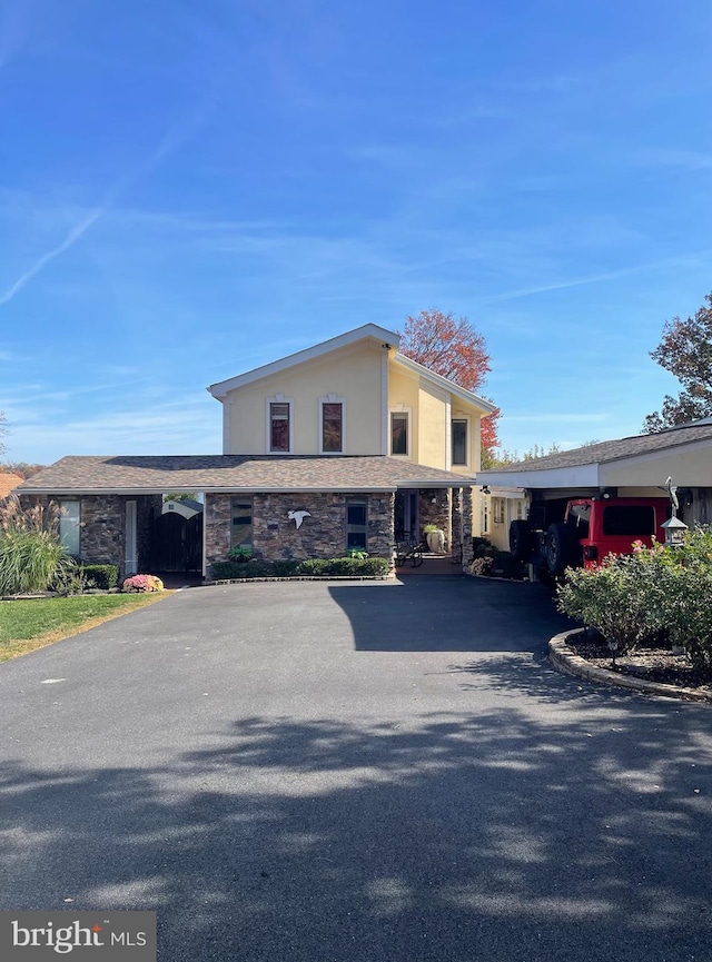 view of front of home featuring a carport