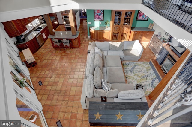 living room with tile patterned floors and sink