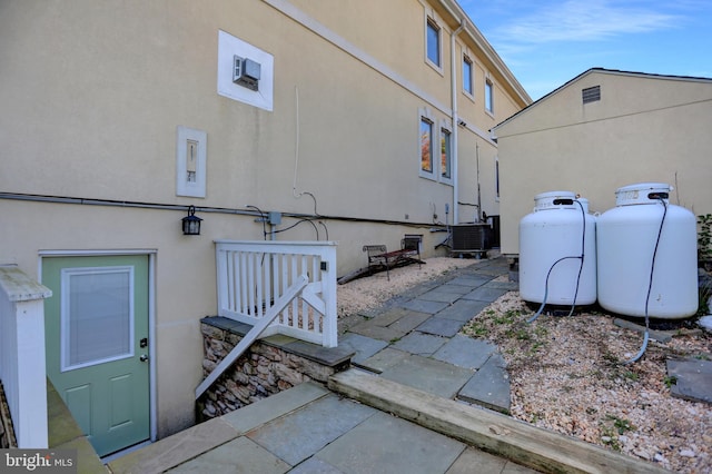 view of home's exterior featuring a patio area and central AC unit