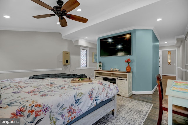 bedroom with crown molding, wood-type flooring, and ceiling fan