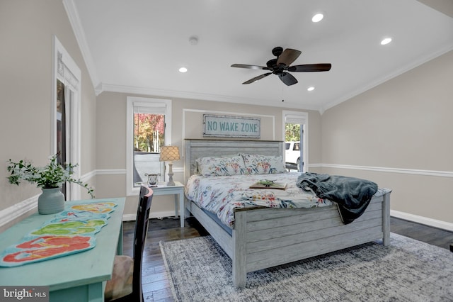 bedroom featuring crown molding, dark hardwood / wood-style floors, and ceiling fan