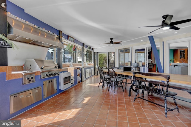 view of patio / terrace featuring an outdoor kitchen, area for grilling, and ceiling fan