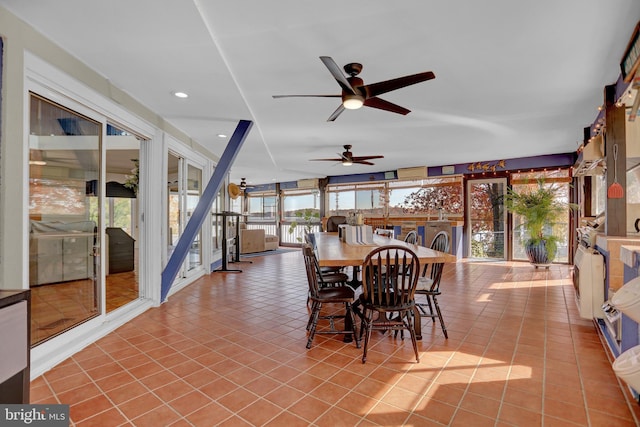 dining room featuring light tile patterned flooring and ceiling fan