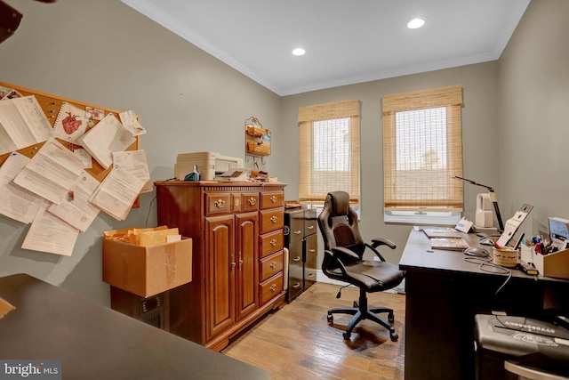 office area featuring light hardwood / wood-style flooring and crown molding