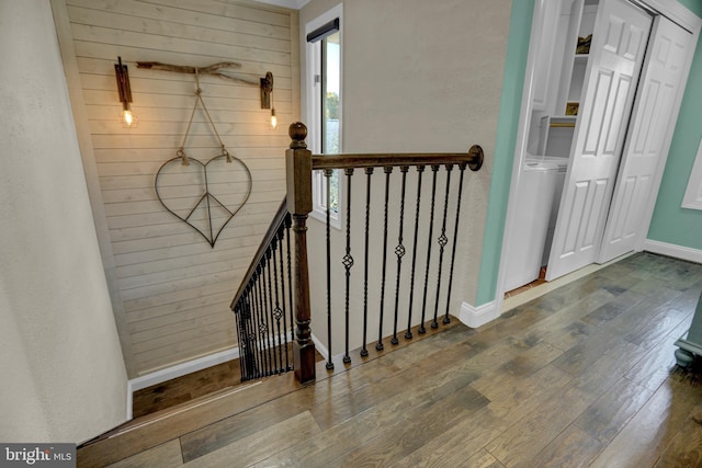 stairs featuring hardwood / wood-style flooring