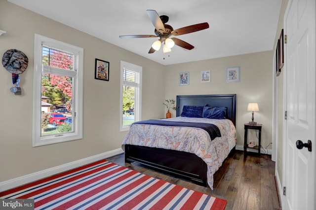 bedroom featuring dark hardwood / wood-style floors and ceiling fan