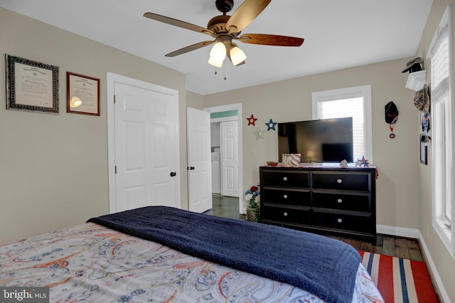 bedroom with dark hardwood / wood-style floors and ceiling fan