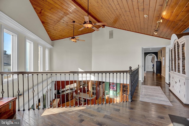 hall featuring beam ceiling, high vaulted ceiling, wooden ceiling, and dark hardwood / wood-style flooring