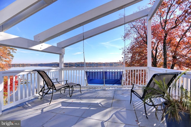 wooden deck with a water view