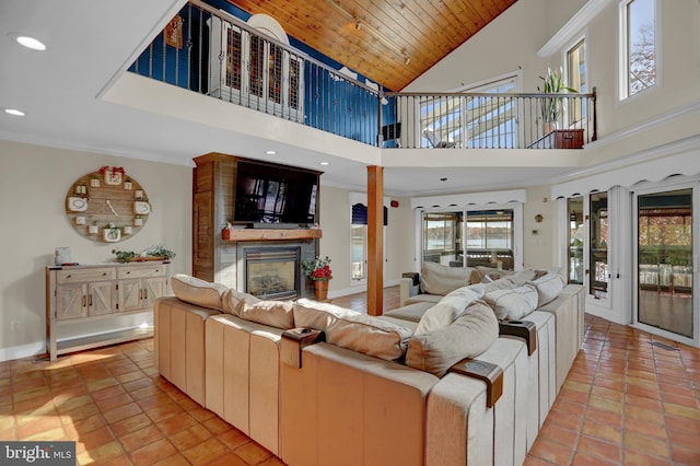 living room with wood ceiling, a fireplace, high vaulted ceiling, and light tile patterned floors