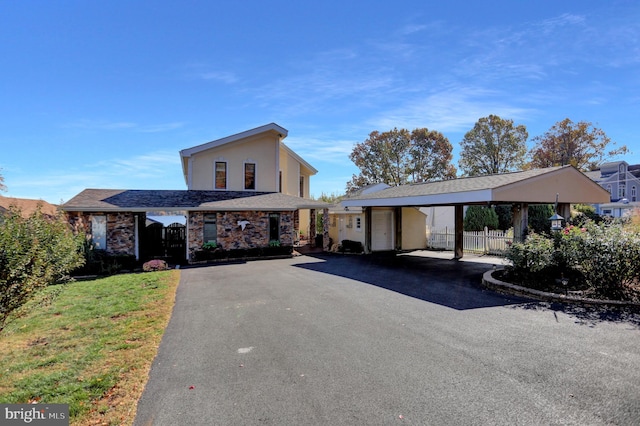 view of front of home featuring a carport