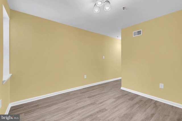 empty room with light wood-type flooring