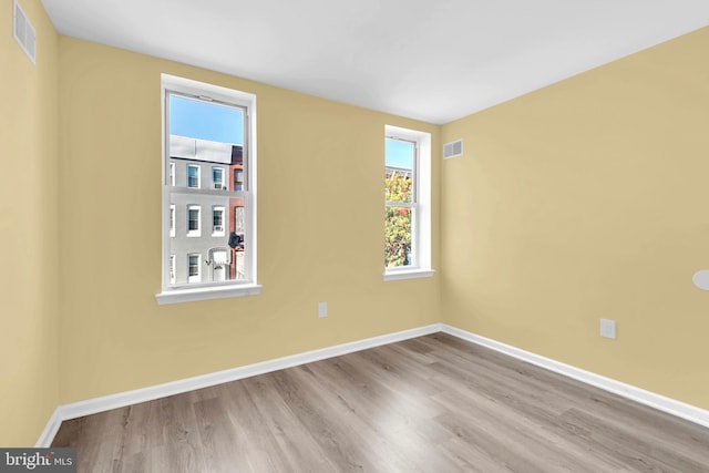 empty room with light wood-type flooring