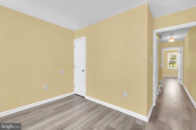 empty room with light hardwood / wood-style floors