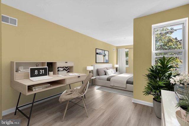 bedroom with light hardwood / wood-style flooring