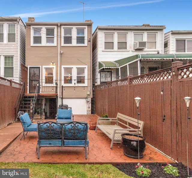 213 Channing St NE, Washington, DC 20002 - back of house with a patio area, a fenced backyard, an outdoor living space with a fire pit, stairway, and cooling unit