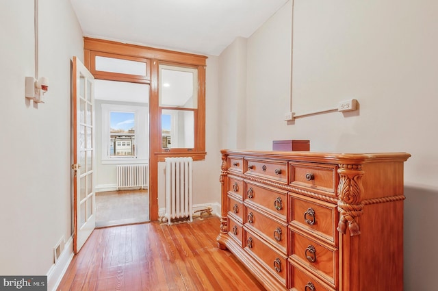 213 Channing St NE, Washington, DC 20002 - hallway featuring radiator and light wood-style flooring