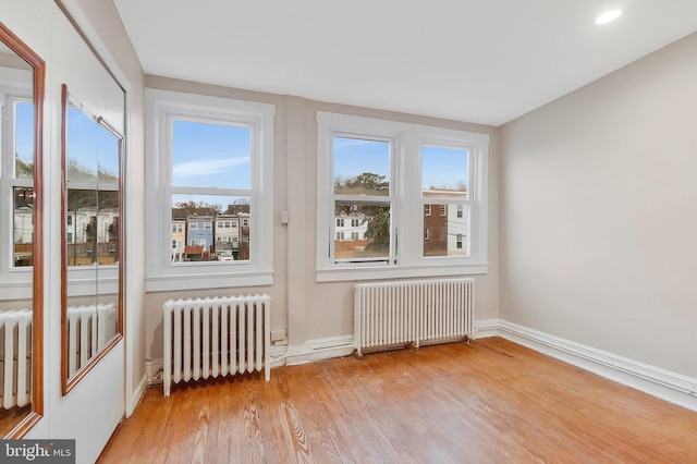 unfurnished sunroom with radiator