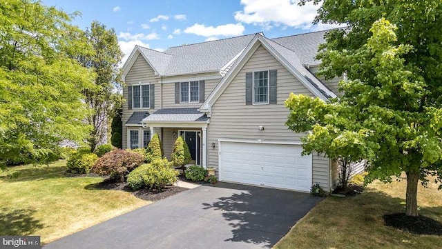 front of property with a garage