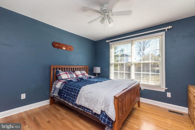 bedroom with light wood-type flooring and ceiling fan