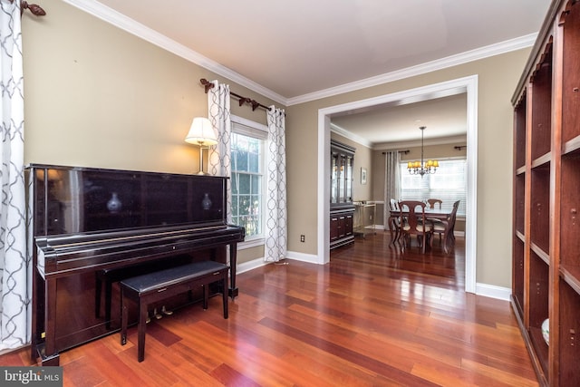 misc room featuring crown molding, dark wood-type flooring, and plenty of natural light