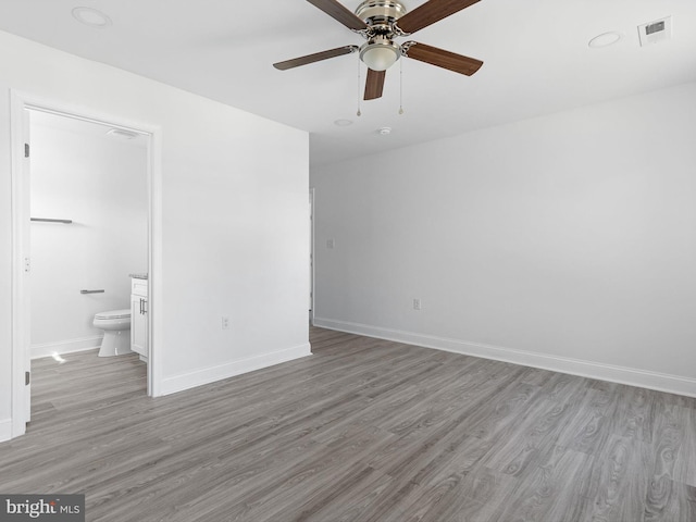 empty room with light hardwood / wood-style floors and ceiling fan