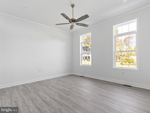 unfurnished room with crown molding, light hardwood / wood-style flooring, and ceiling fan