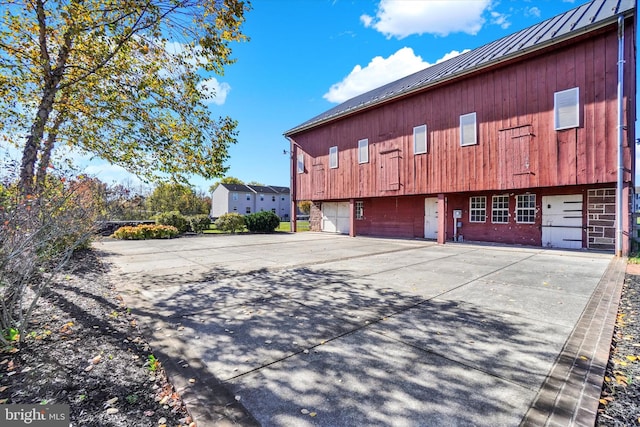 view of side of property with a garage