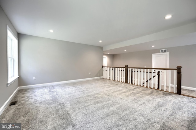 empty room with carpet flooring