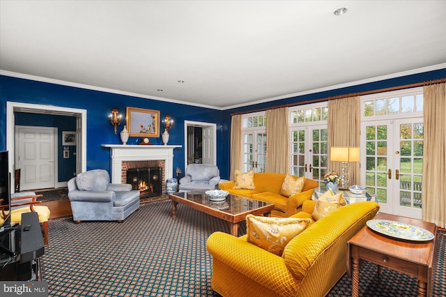 carpeted living room with a fireplace, crown molding, and french doors