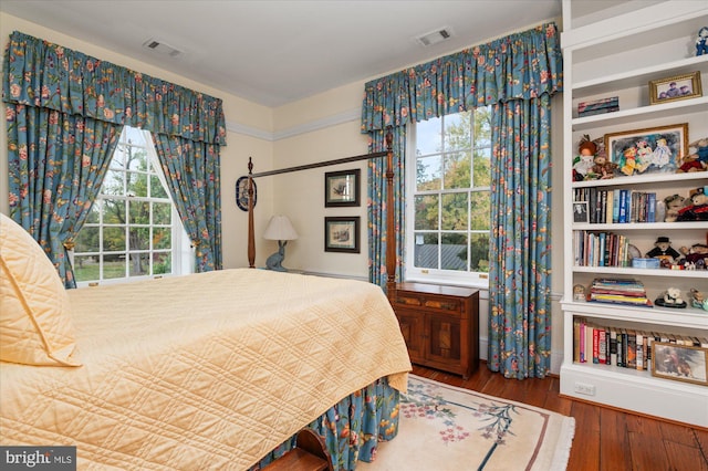 bedroom featuring dark hardwood / wood-style flooring