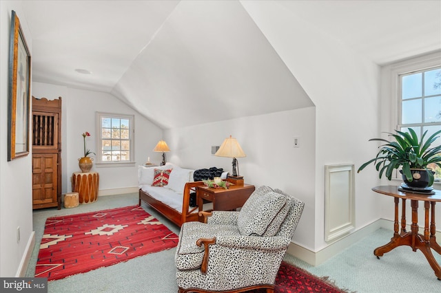 bedroom with light carpet and vaulted ceiling