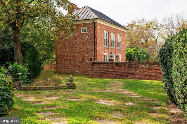 view of property exterior featuring a yard