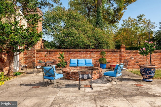 view of patio featuring an outdoor fire pit