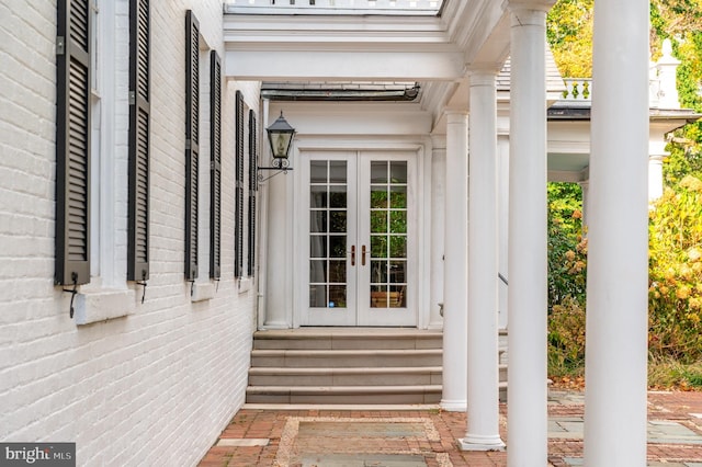 view of exterior entry featuring french doors