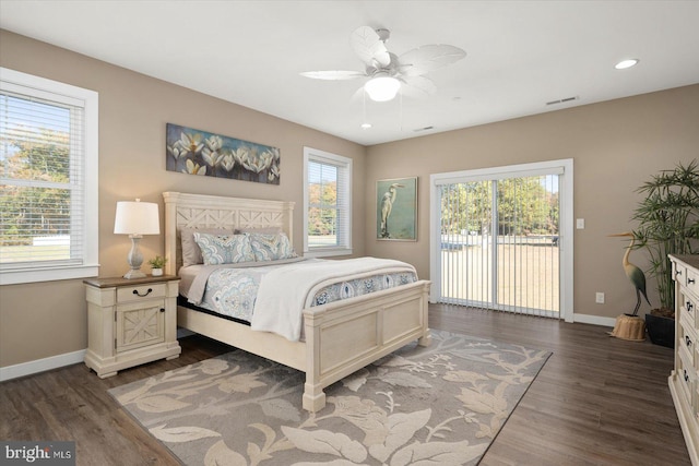 bedroom with ceiling fan, dark hardwood / wood-style flooring, multiple windows, and access to exterior