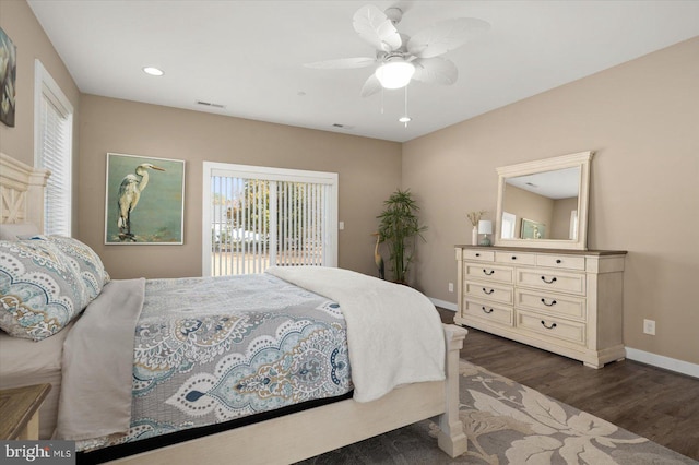 bedroom featuring dark wood-type flooring, ceiling fan, and access to exterior