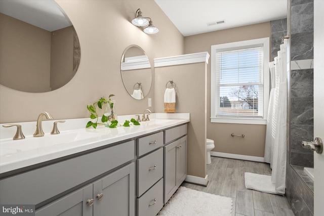 bathroom with vanity, a shower with curtain, wood-type flooring, and toilet