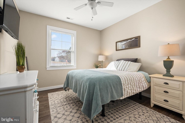 bedroom featuring dark hardwood / wood-style floors and ceiling fan